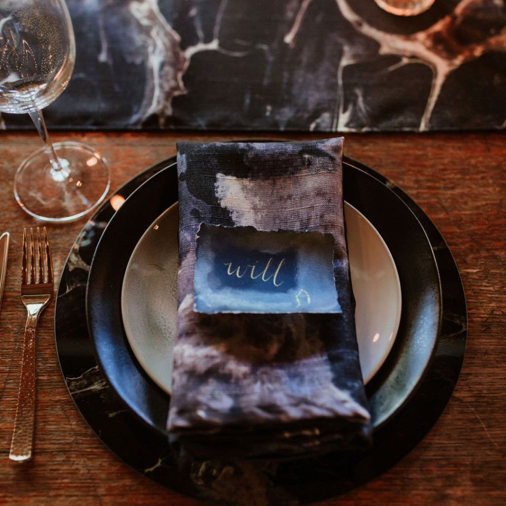 Folded napkin on a charger and plate