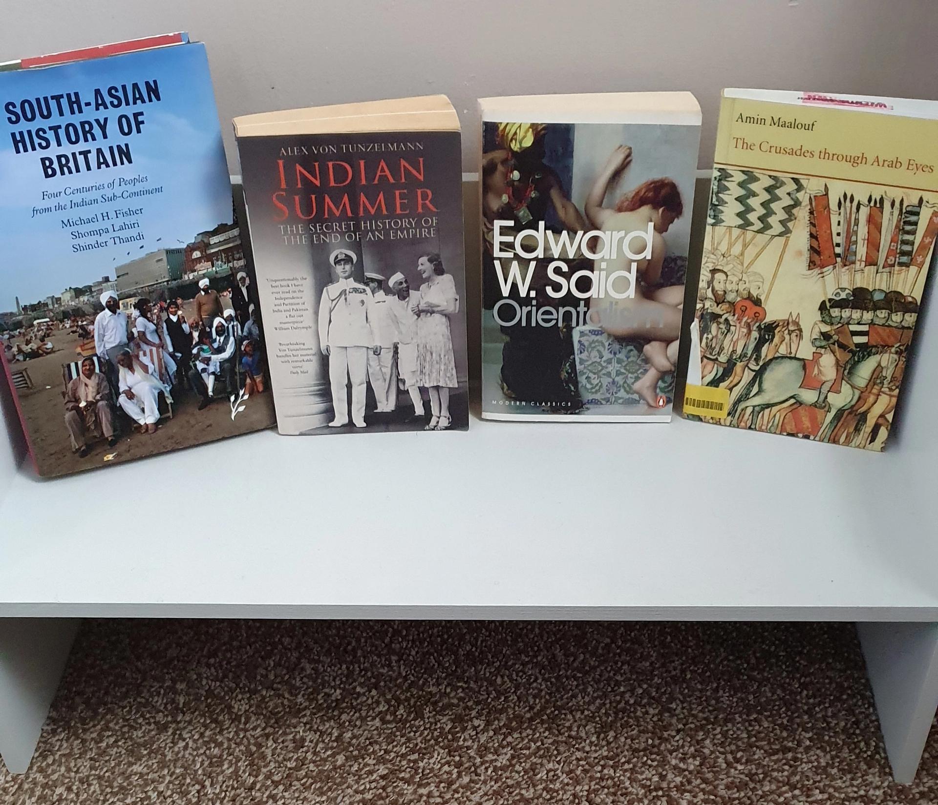 Selection of non-ficton books on a freestanding shelf
