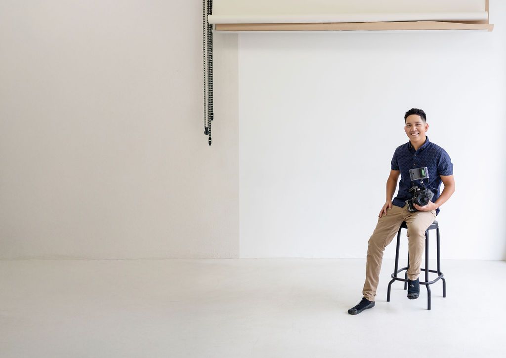 Tony sitting and smiling