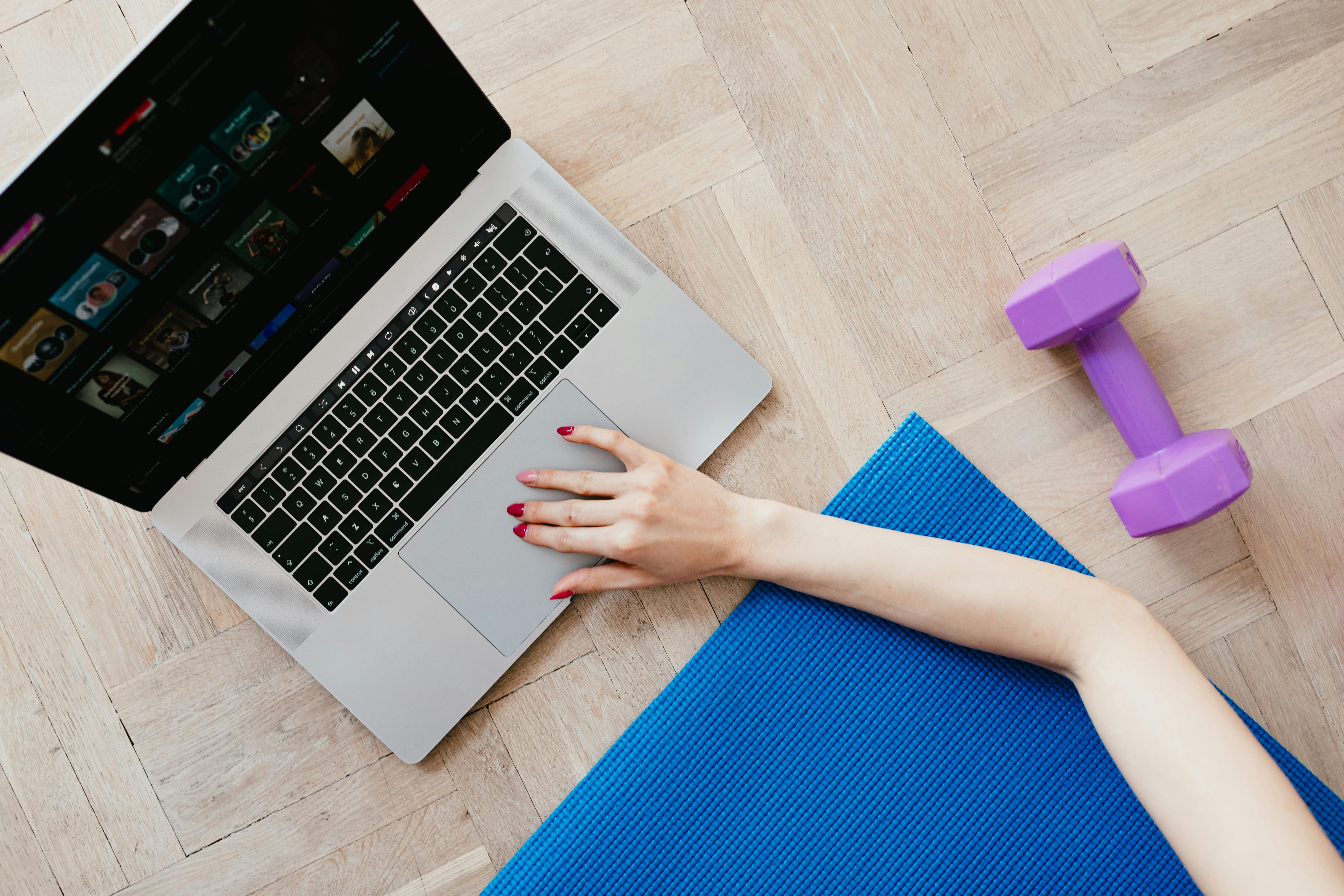 Person massaging wrist due to carpal tunnel pain from repetitive use