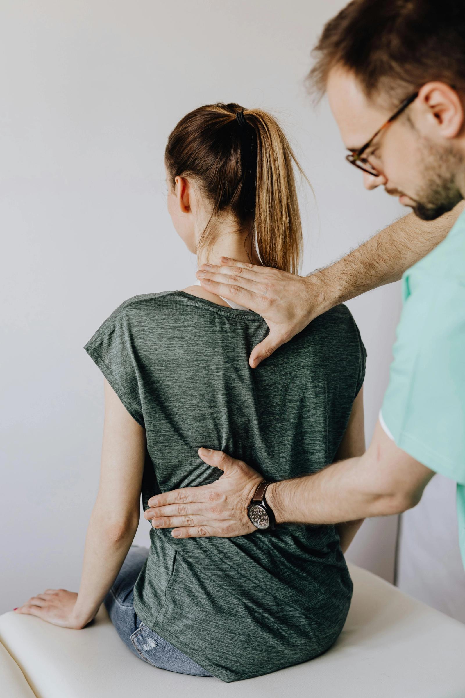 Physiotherapist assessing shoulder mobility and rotator cuff pain