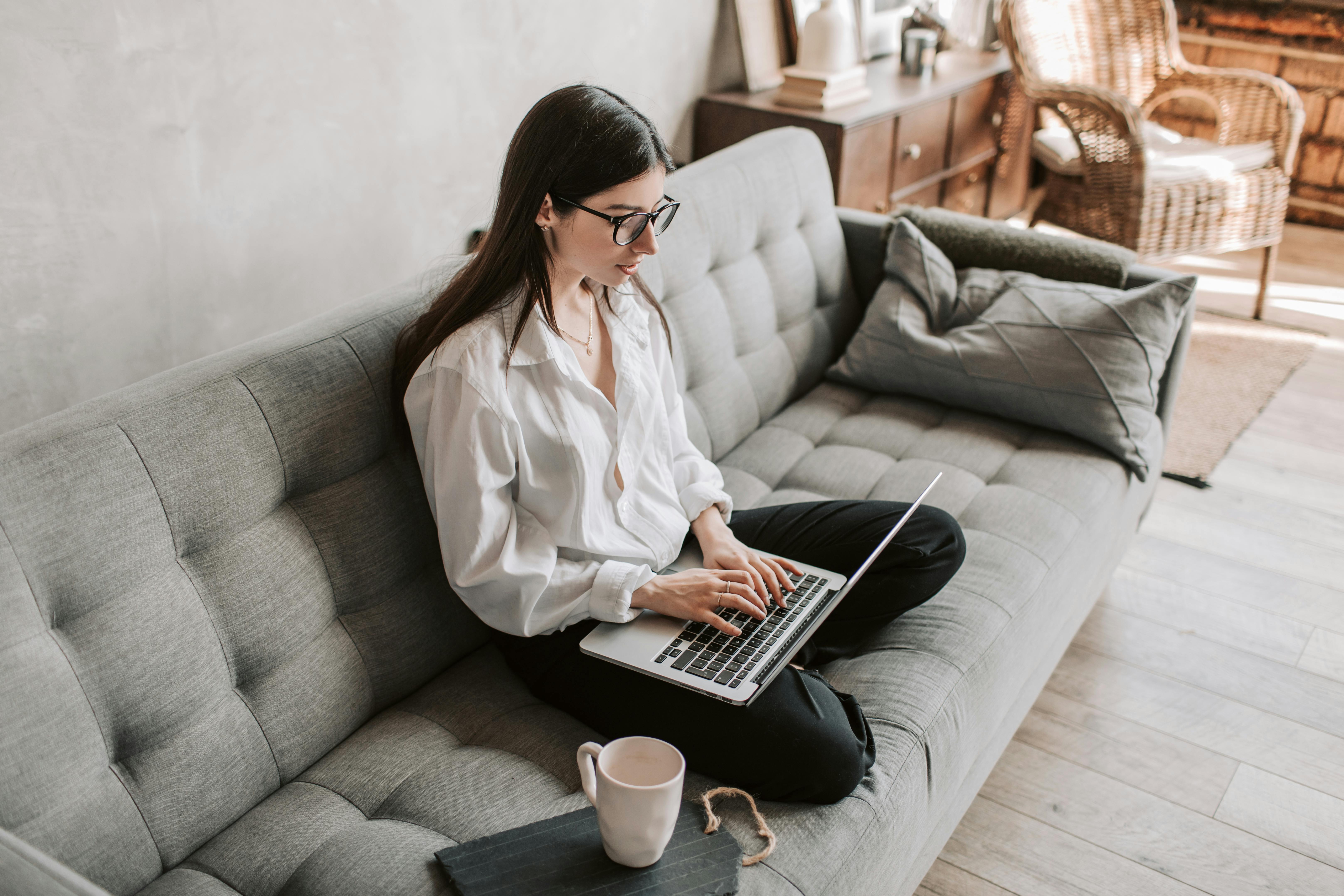 Person sitting at desk with poor posture causing back pain
