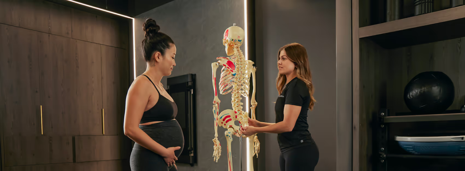 Physiotherapist assisting a patient with a vestibular and balance assessment in a rehabilitation clinic.