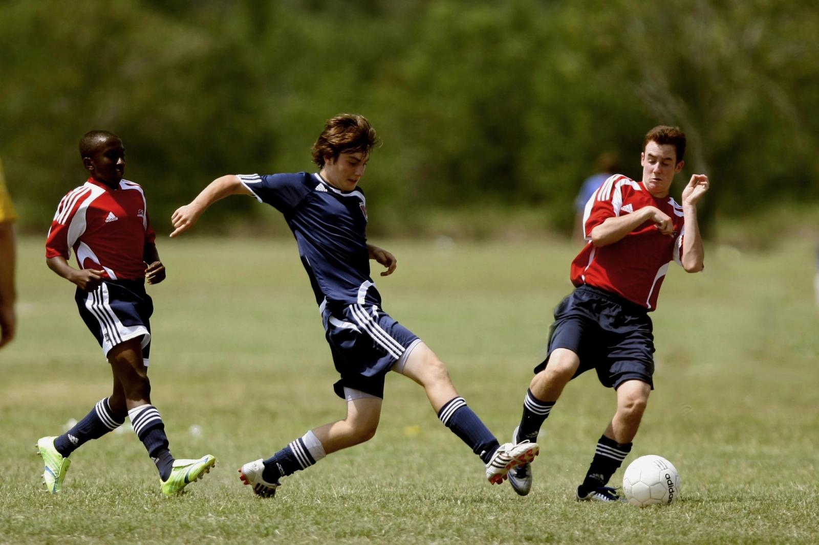 Soccer players colliding during a match illustrating concussion risk