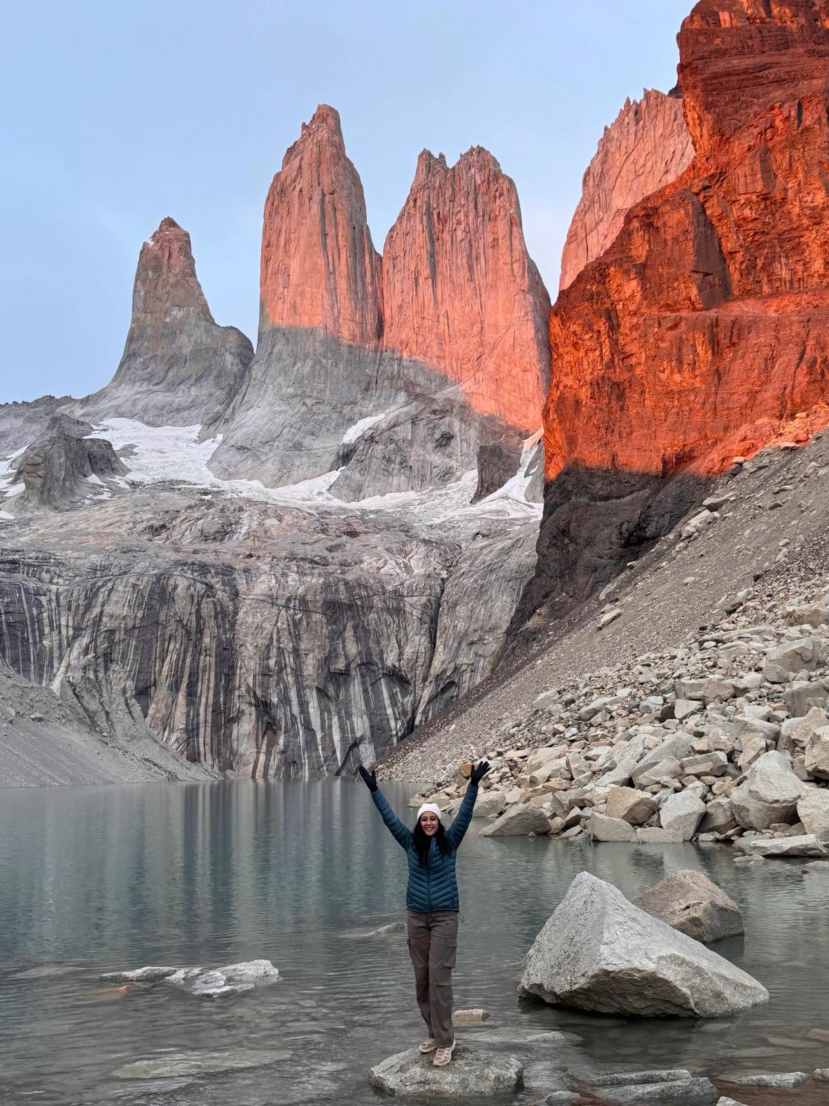 Marisa standing at the Base Towers in Patagonia, Chile.