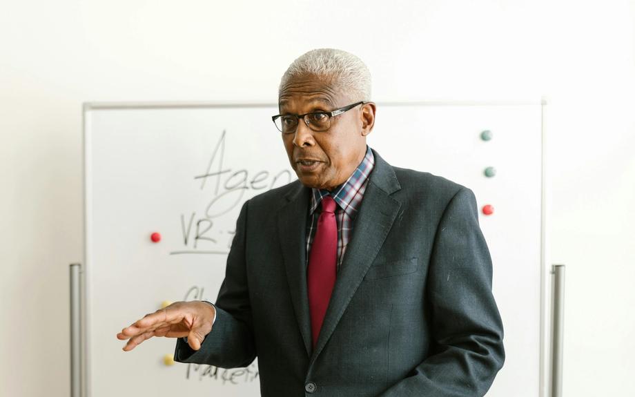 Senior woman walking independently in a park after recovering from a fall with physiotherapy