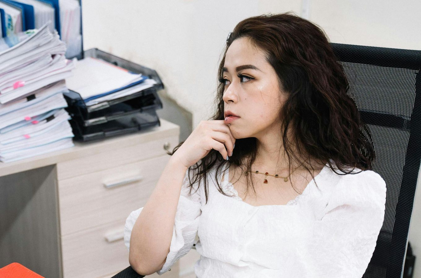 Priya S. sitting in an office.