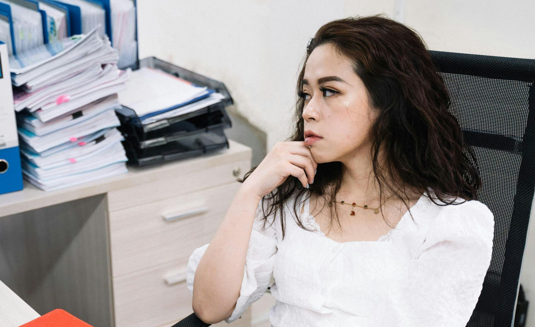 Priya S. sitting in an office.