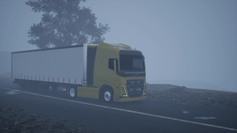 Yellow Volvo FH with a cargo box trailer emerging from dense fog on the same mountain road.