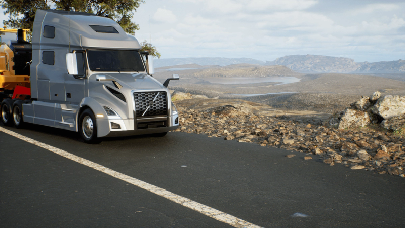 Silver Volvo VNL on a dry mountain road in clear weather — the same environment under a fourth lighting condition.