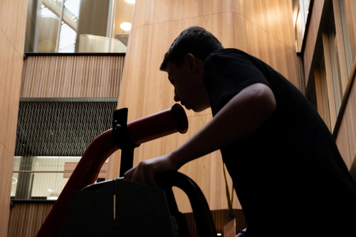 A silhouette of a person speaking into a megaphone