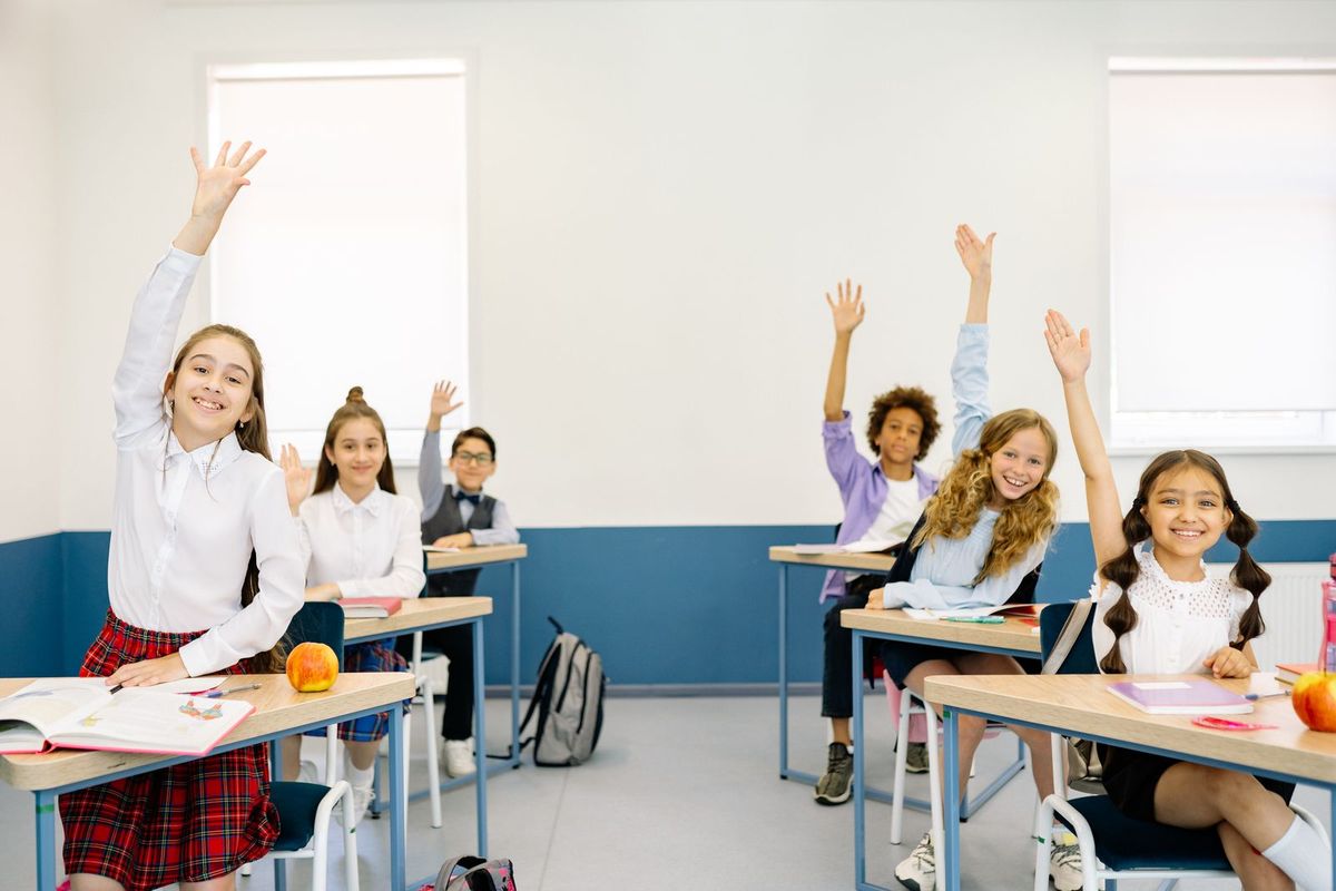 Primary school children engaged in a bright classroom
