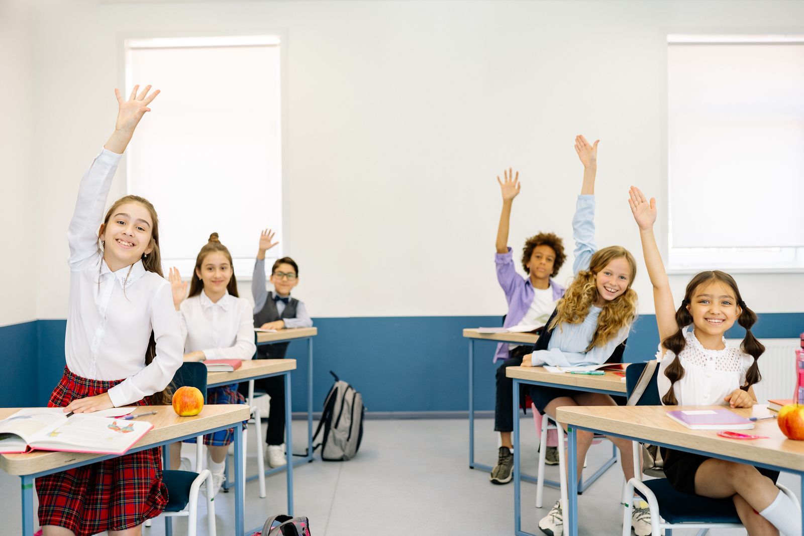 Primary school children engaged in a bright classroom