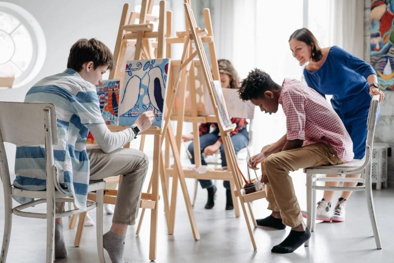 Children painting in a colourful art studio