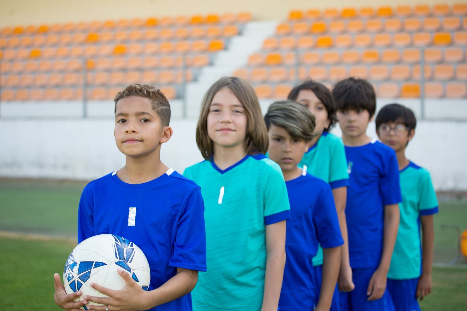 Children playing sports on a school field