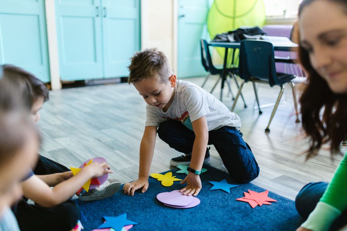 Young children playing and learning in an early-years classroom