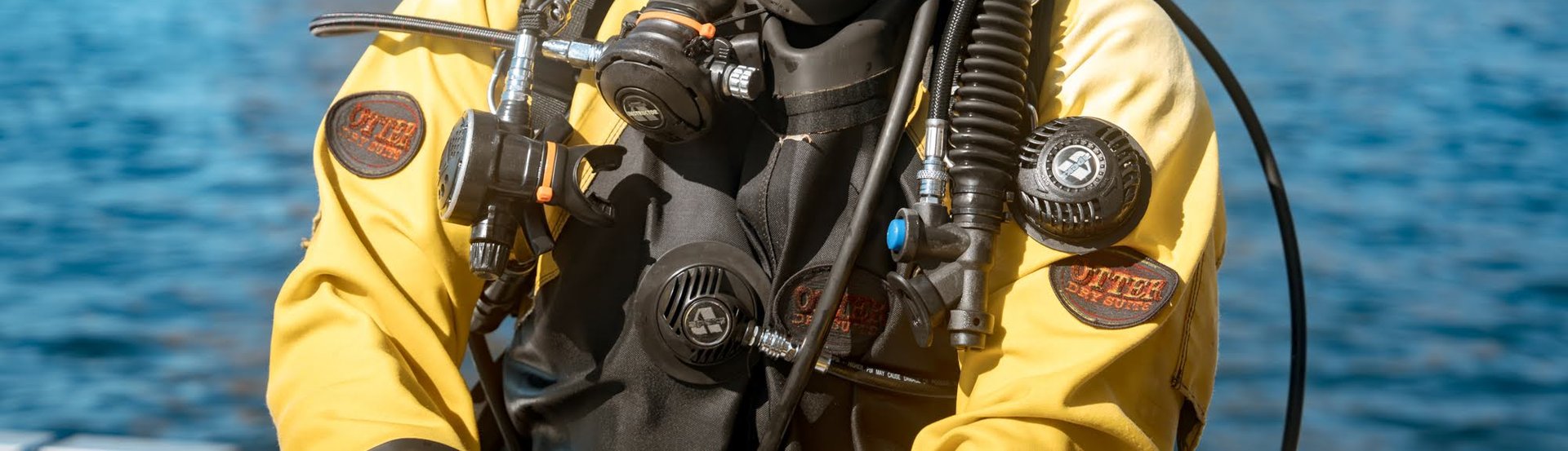 padi dry suit divers at poor knights islands