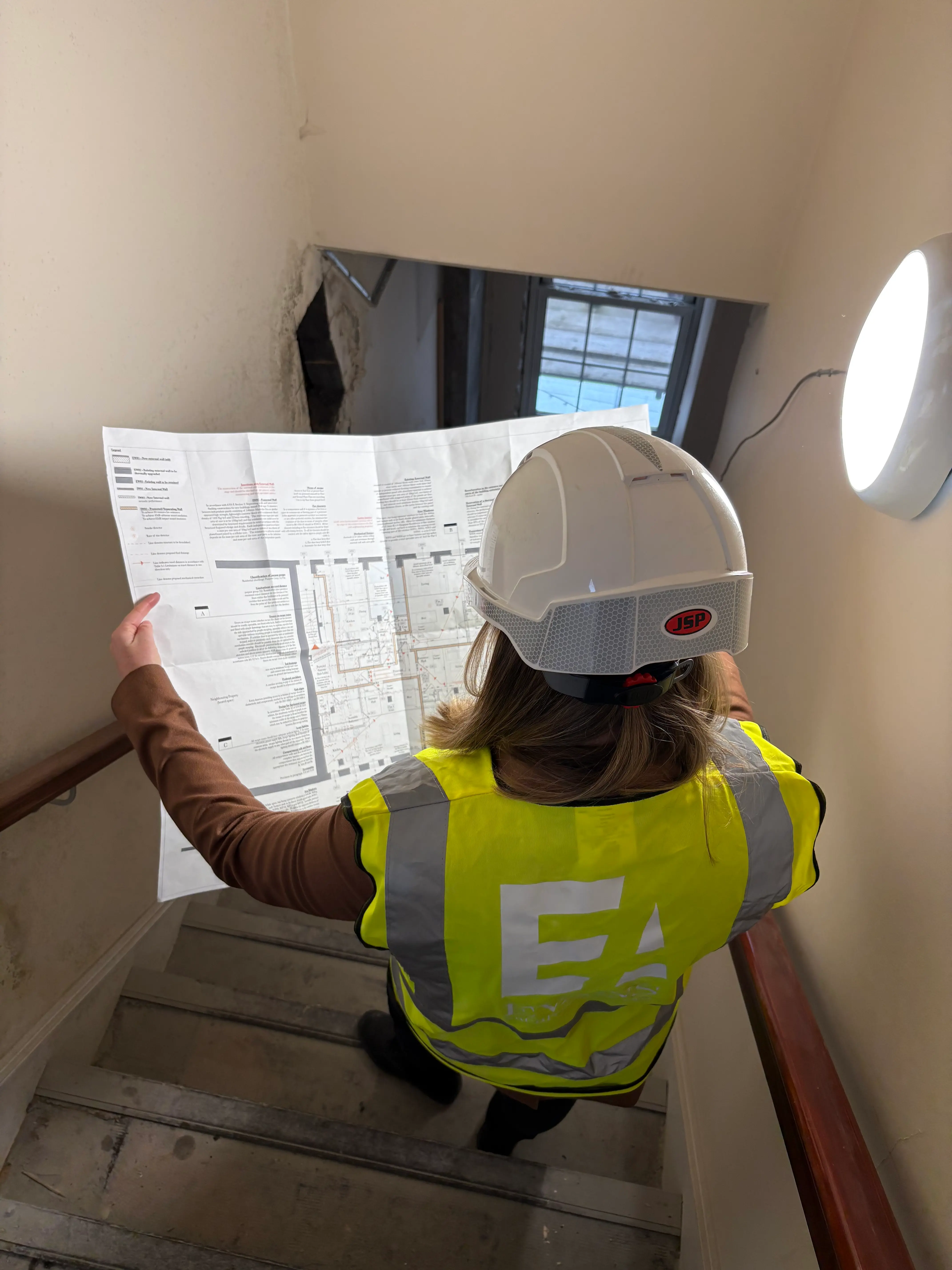 Silvie on site looking at plans