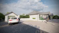 Driveway and garage view of Le Vicheris