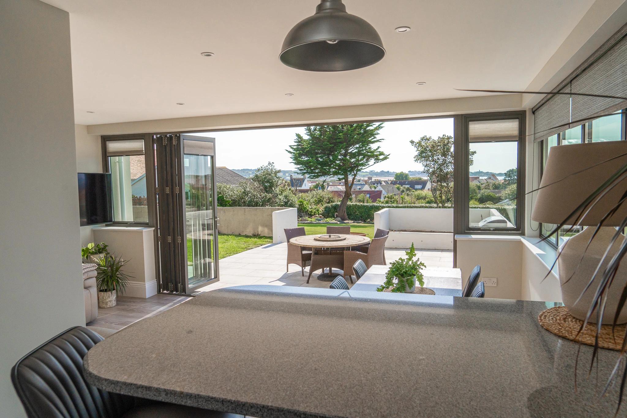 Kitchen shot looking out into garden dining area