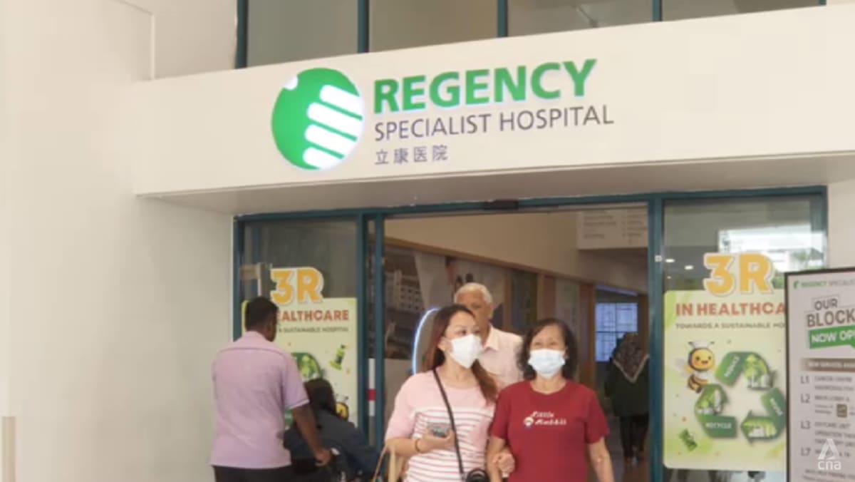 Patients leaving the entrance of Regency Specialist Hospital in Johor Bahru