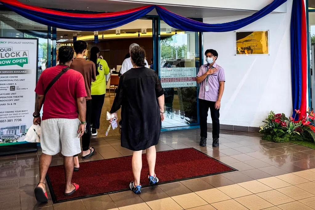 Visitors entering the lobby of Regency Specialist Hospital