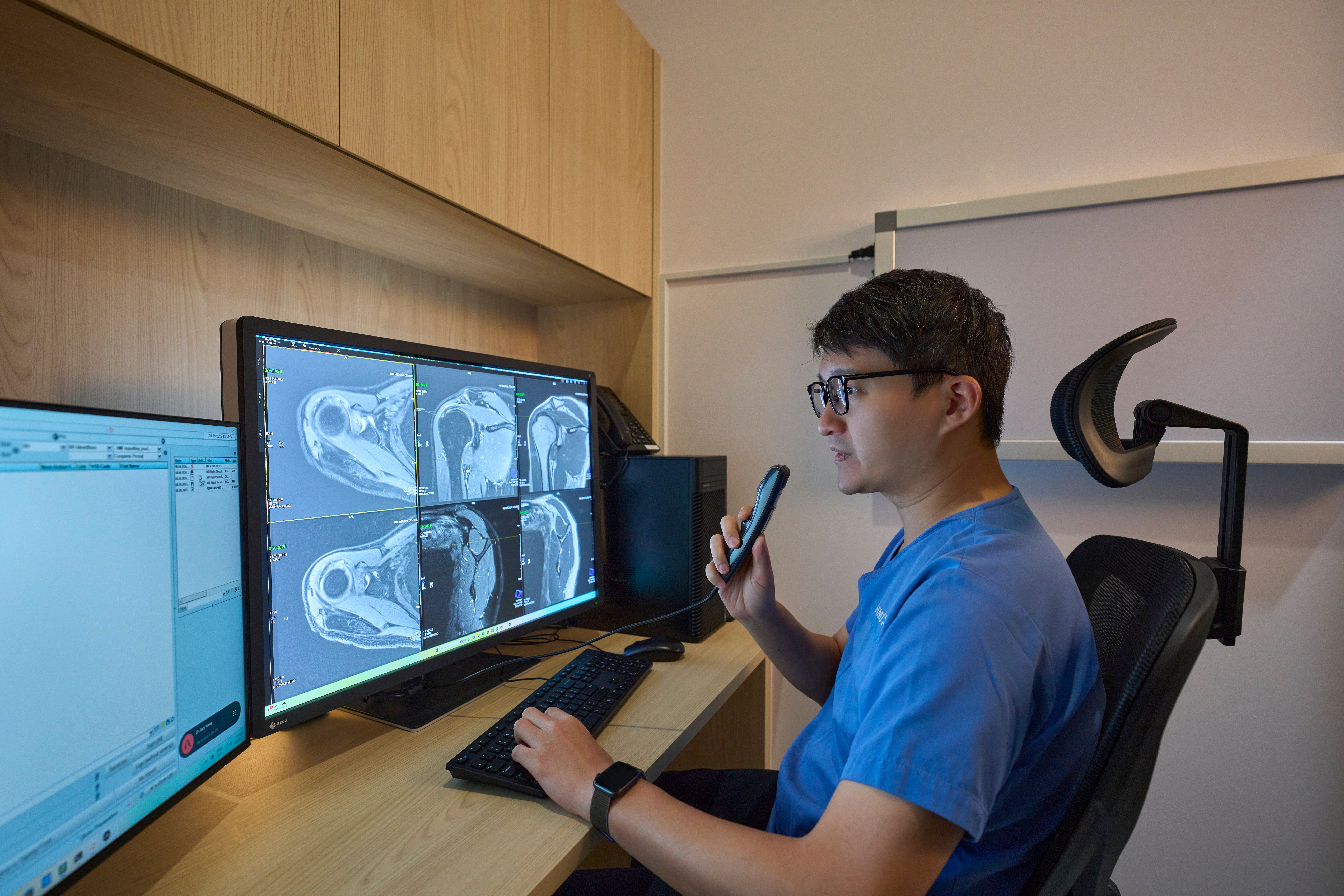 Dr Gary Yoong, interventional radiologist at HMI Medical, reviewing a scan
File name: dr-gary-yoong-interventional-radiologist-hmi.jpg