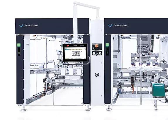 The front view shows a Schubert packaging machine. A panel PC is located in the center. 