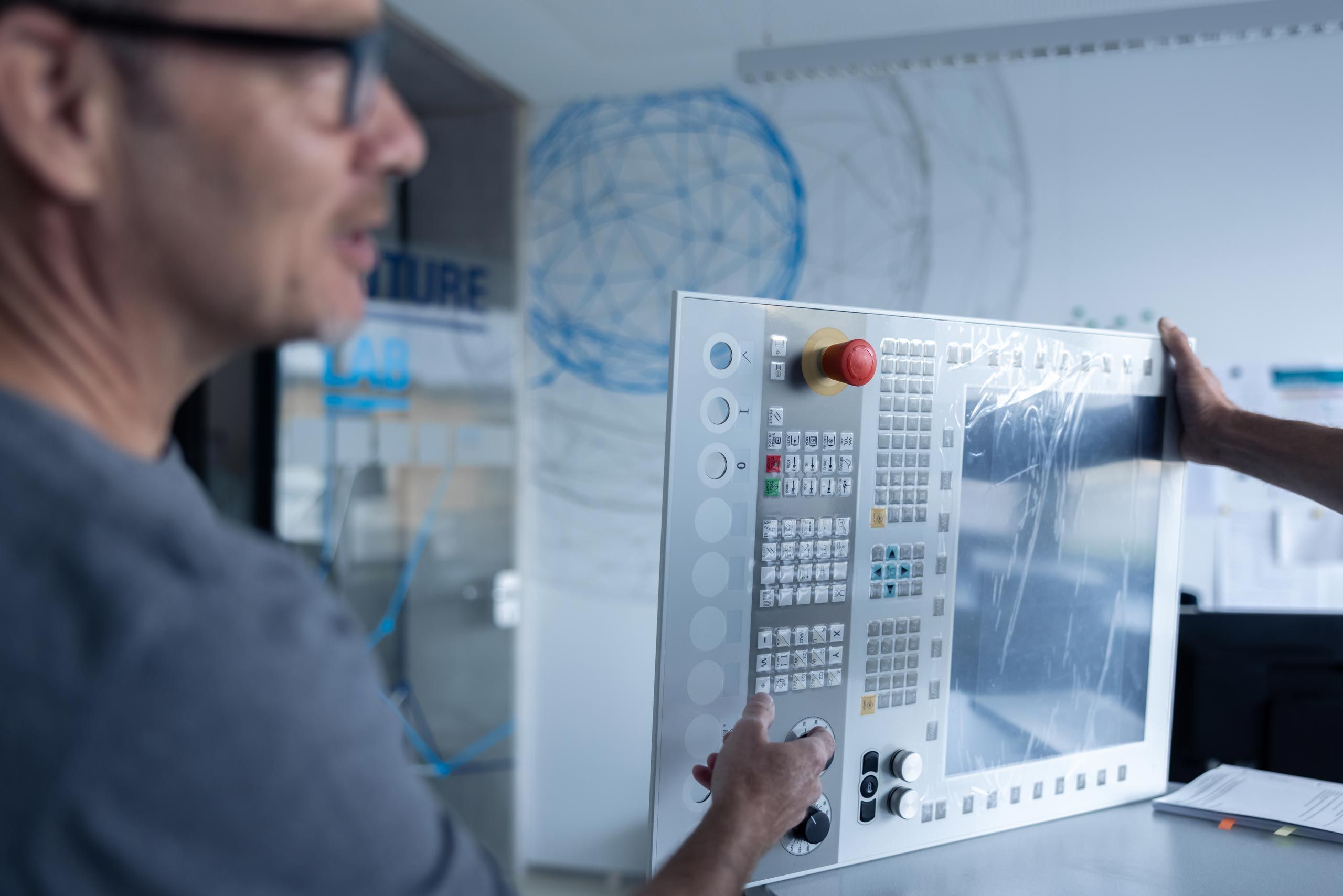 An employee talking to an element of a panel IPC
