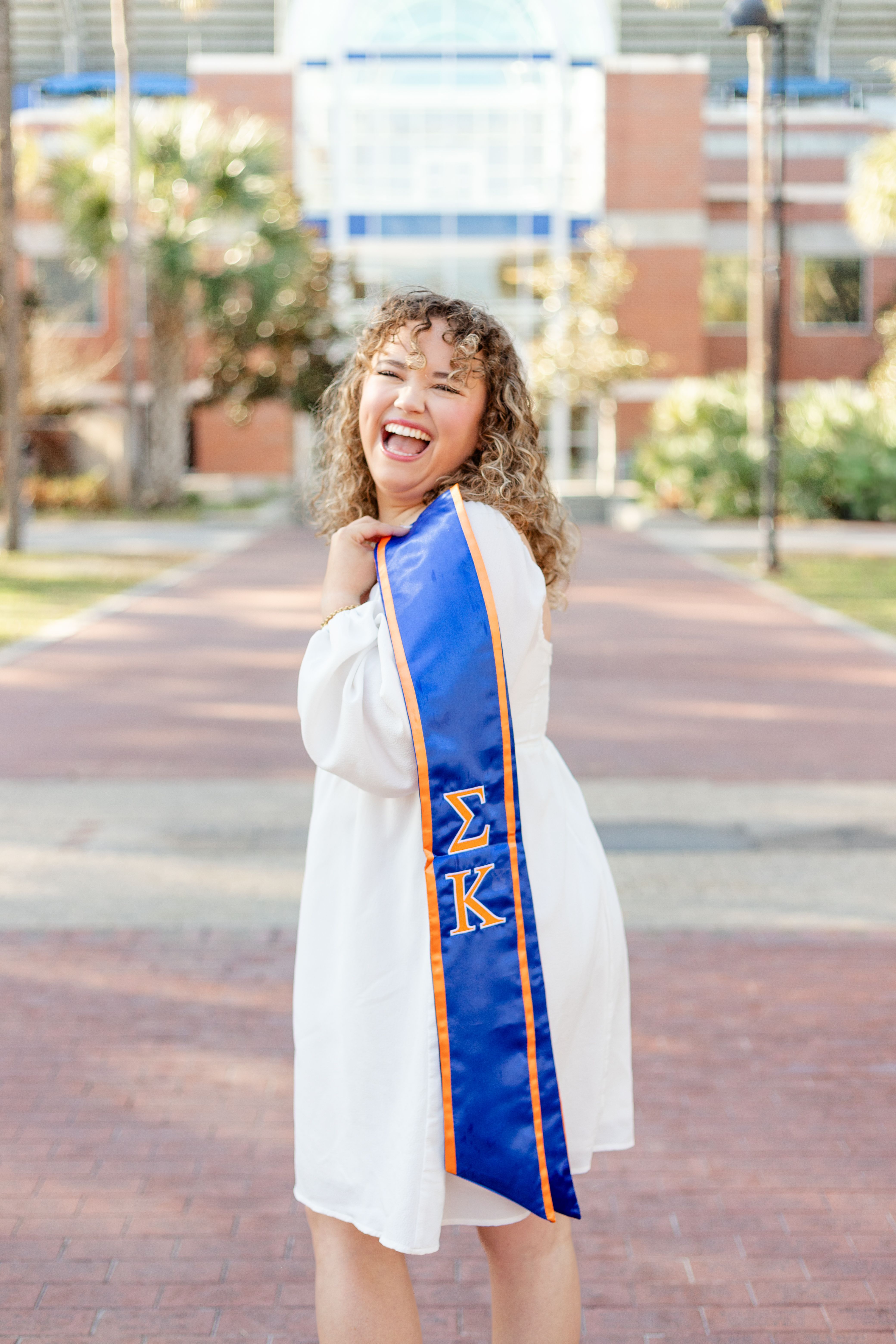 UF senior in a Florida Gator jersey for graduation photos