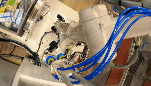 Robot adjusts its motion and path based on the object characteristics and grasp quality, taking into account the physical boundaries