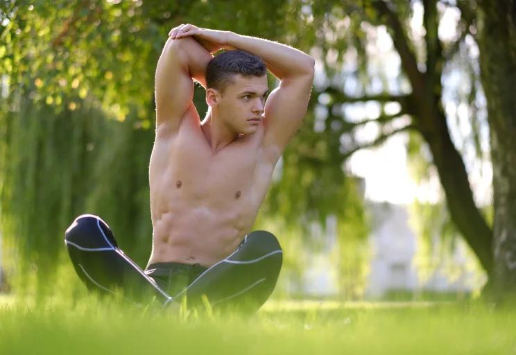 Man 40s lifting, gym, natural window light