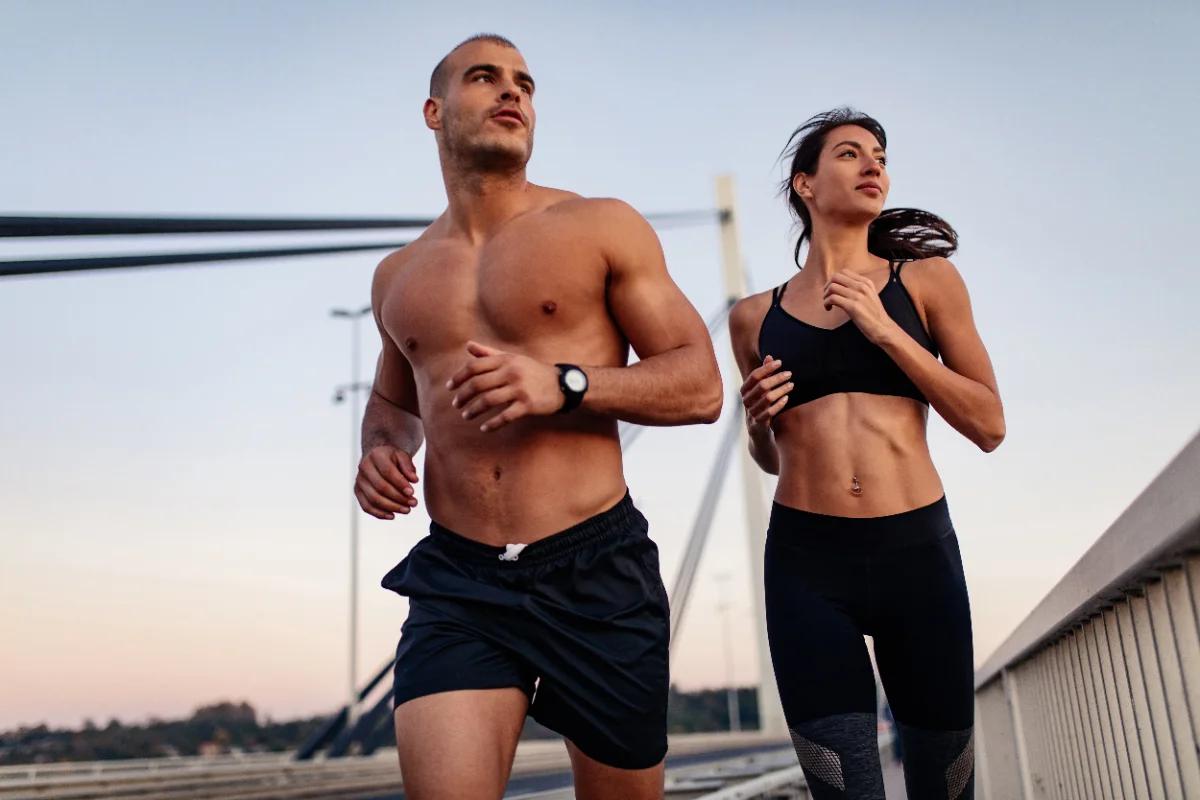 Couple running outdoors in morning light