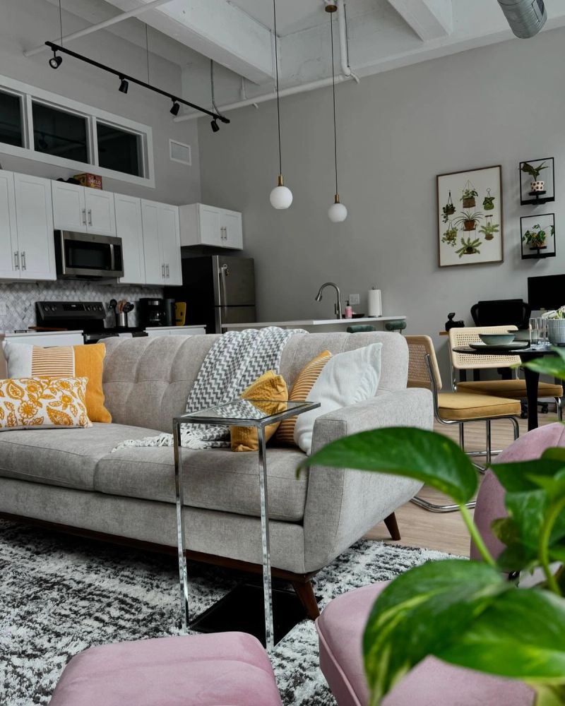 Bold open-concept loft transformation with pop-modern styling