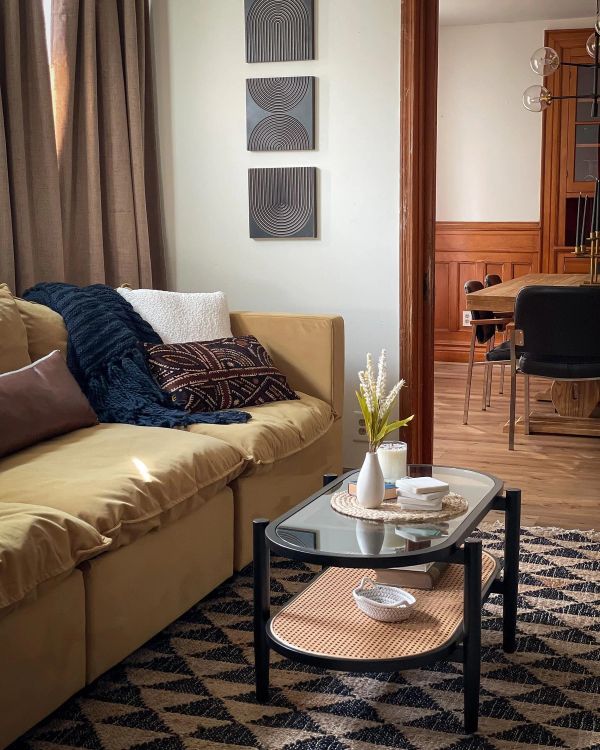 Afro-bohemian living room refresh with mid-century furniture and woven accents in Buffalo NY
