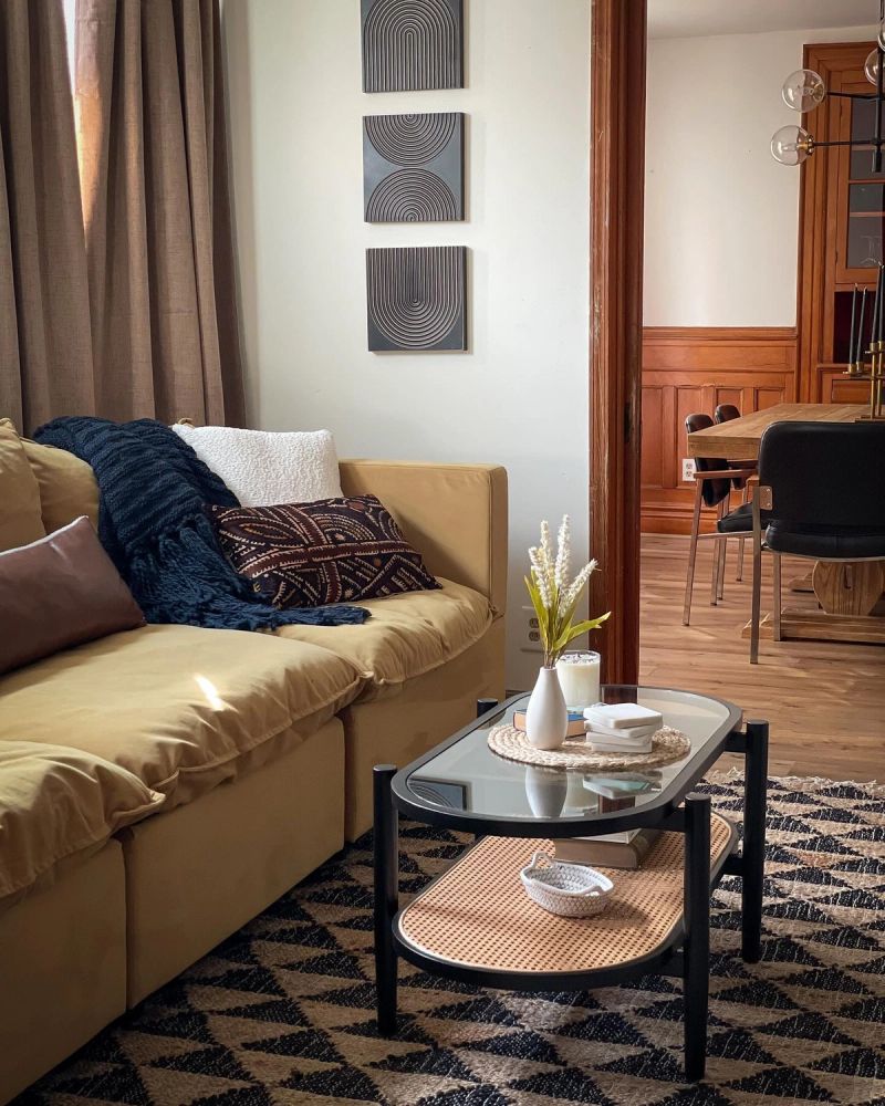 Afro-bohemian living room refresh with mid-century furniture and woven accents in Buffalo NY