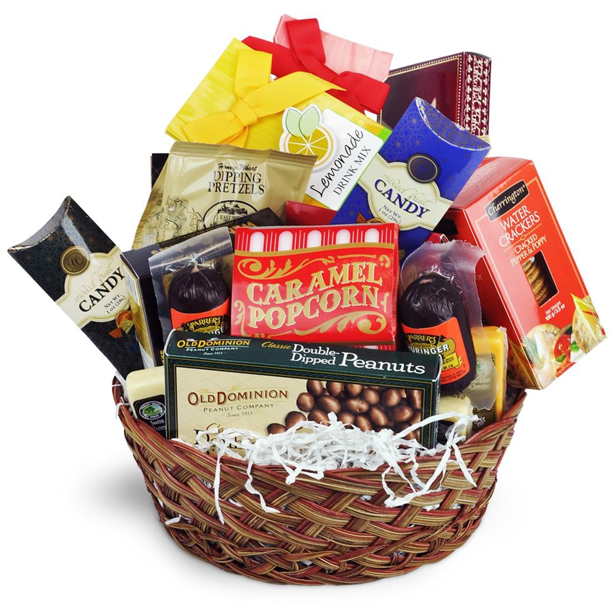 a wicker gift basket filled with a variety of snacks and candy