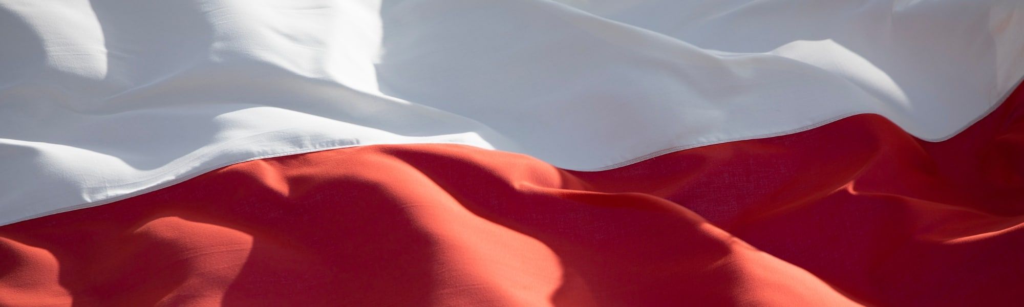Close up of Polish flag, representing a blog that discusses Poland eInvoice requirements