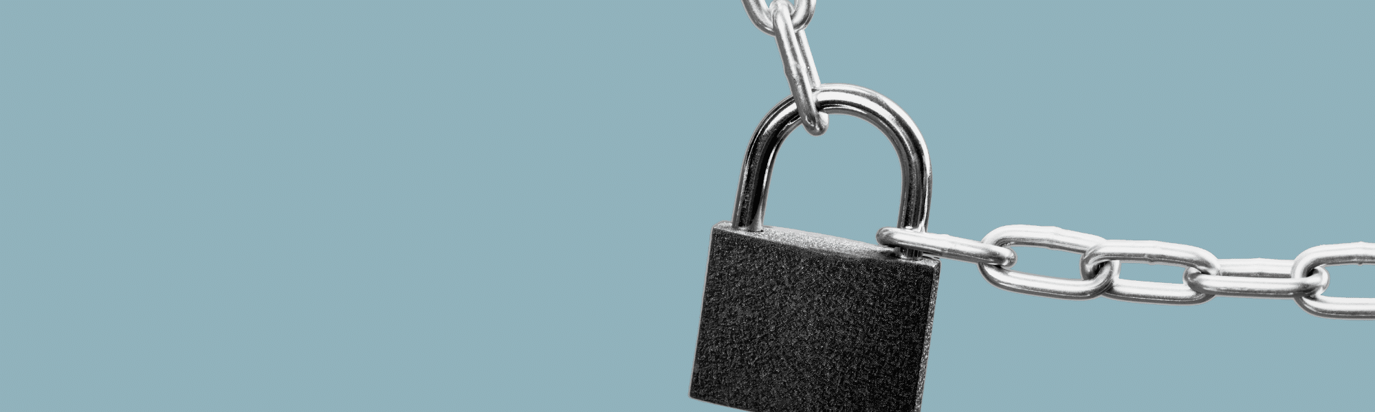 cut out image of a lock on a chain with a plain grey-blue background
