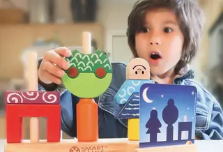 Felihkatubbe son plays with Day and Night Smart Game 