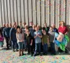 A group of Timberdoodle people celebrates with lots of confetti