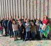 A group of Timberdoodle people celebrates with lots of confetti