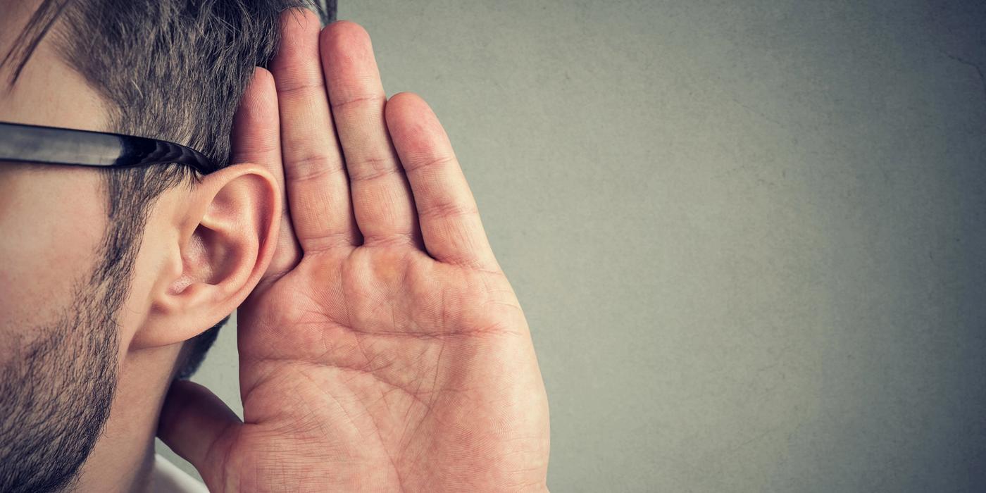 Image with man listening to website agency secrets