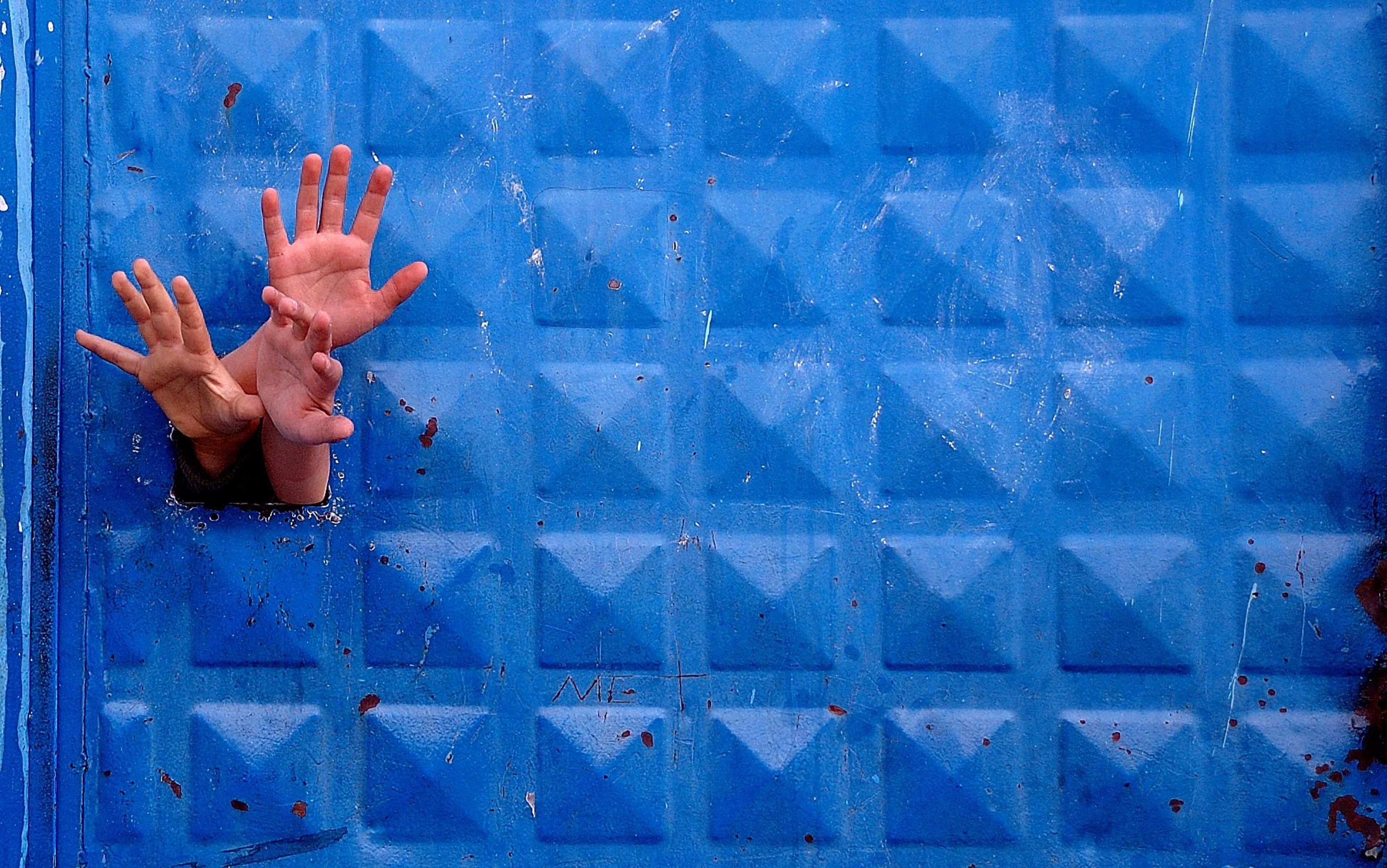 Hands Blending into Blue