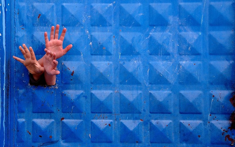 Hands Blending into Blue
