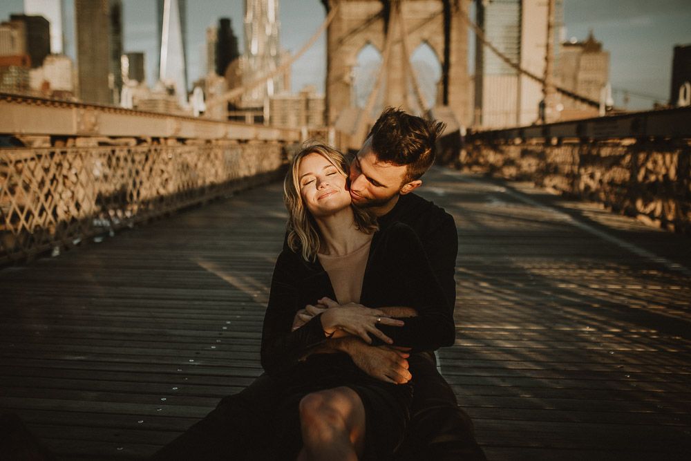 Couple on brooklyn bridge at sunrise during elopement photoshoot