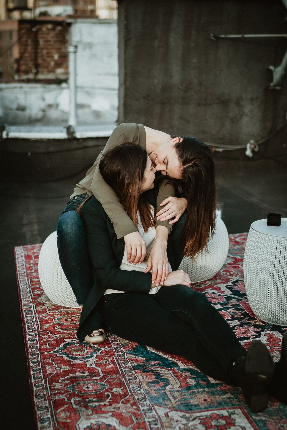 LGBTQ couple during engagement session on nyc rooftop