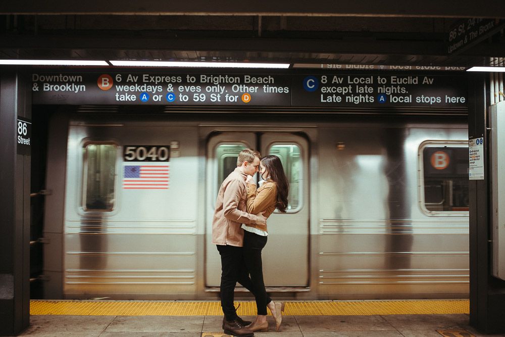 Couple during engagement shoot in the nyc subway