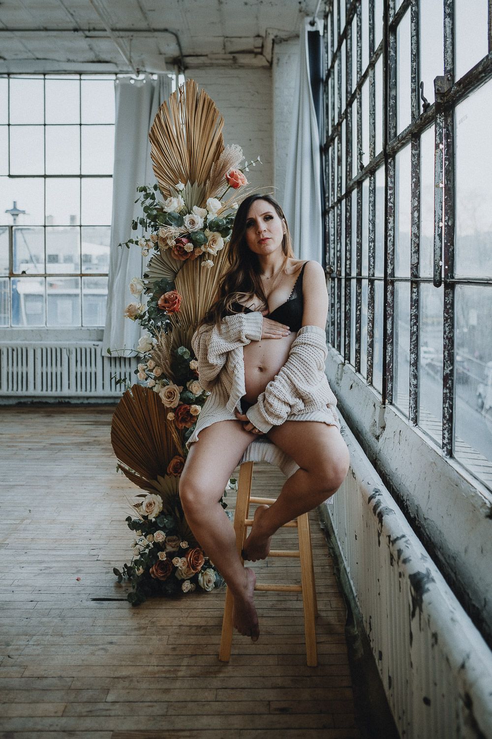 Intimate maternity photoshoot in brooklyn studio with flowers
