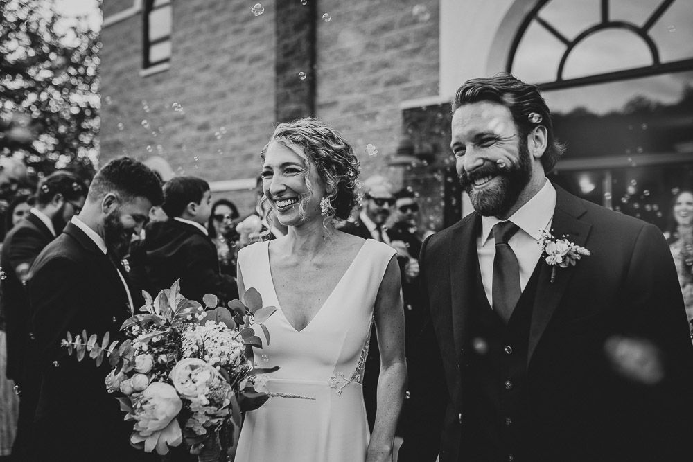 Bride and groom bubble exit after hudson valley wedding ceremony